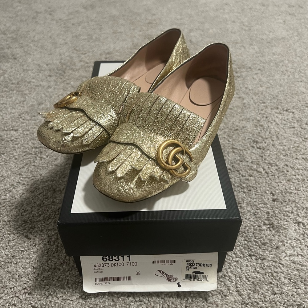 Gold Gucci flats